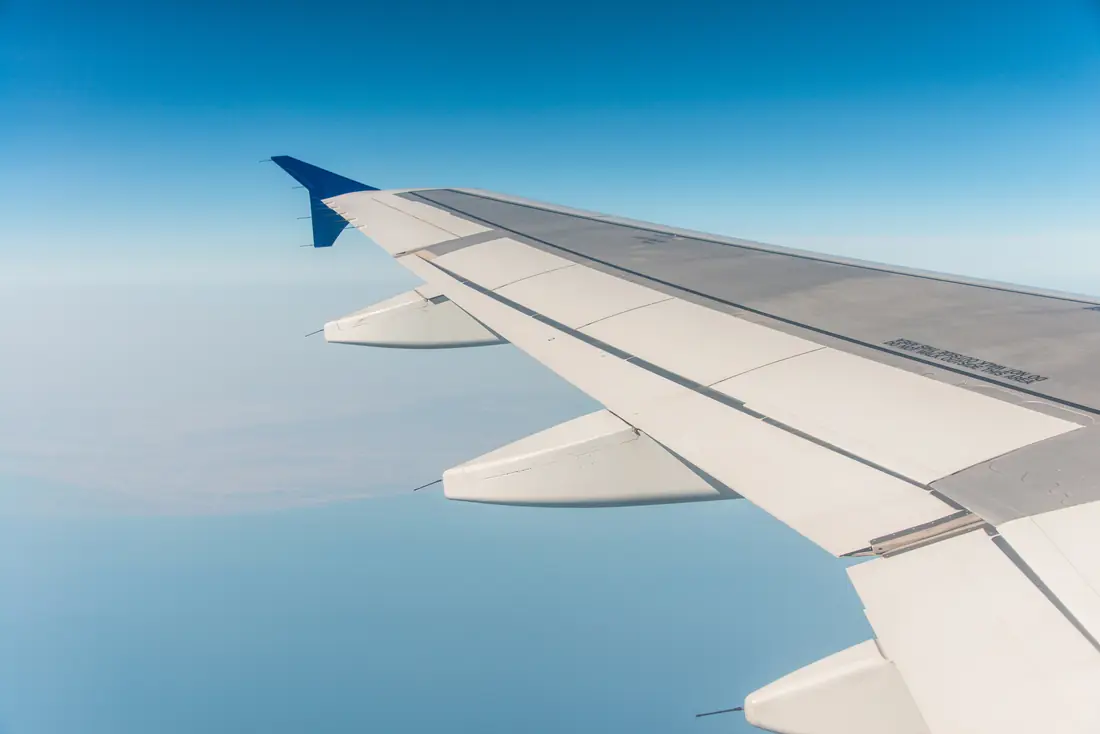 Aircraft wing above the clouds
